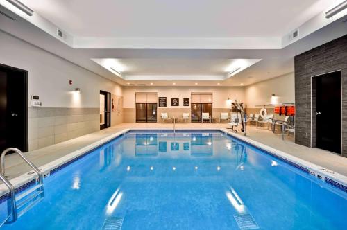 a large swimming pool in a hotel at Homewood Suites by Hilton Cincinnati/West Chester in West Chester