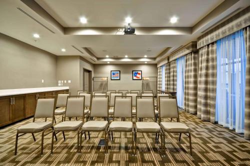 a conference room with a row of chairs in it at Homewood Suites by Hilton Cincinnati/West Chester in West Chester