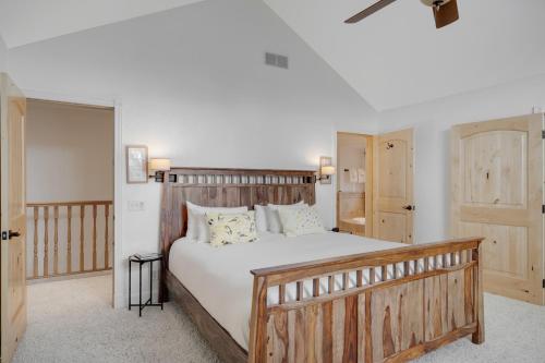 a bedroom with a large bed with a wooden headboard at Mountain Haven Retreat in Driggs