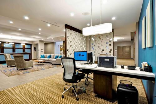 an office with a desk with a computer on it at Homewood Suites by Hilton Cincinnati/West Chester in West Chester