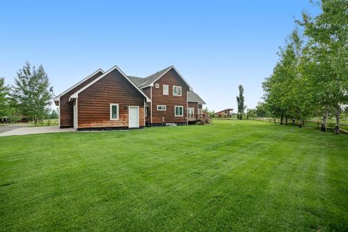 a large yard in front of a house at Mountain Haven Retreat in Driggs