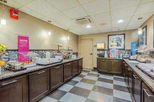 a restaurant with a buffet line with food at Hampton Inn Tampa International Airport/Westshore in Tampa