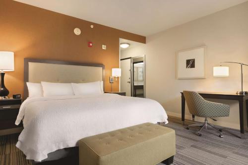 a hotel room with a bed and a desk at Hampton Inn & Suites - Roanoke-Downtown, VA in Roanoke