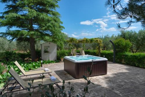 a hot tub in the middle of a patio at Agriturismo Masseria Aprile in Locorotondo
