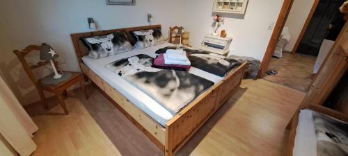 a bedroom with a large bed in a room at Fewo Hereinspaziert in Schwendau