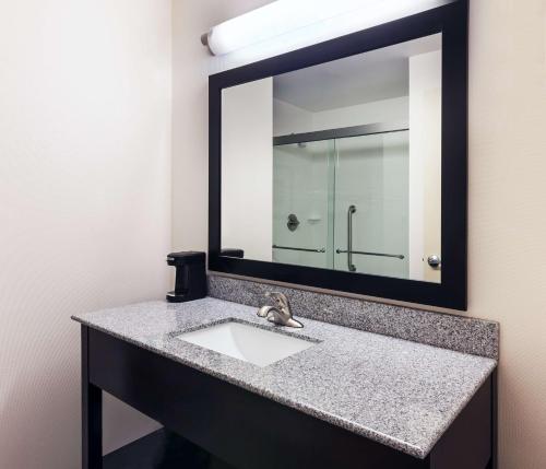 a bathroom with a sink and a mirror at Hampton Inn Marion in Marion