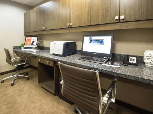 an office with a desk with a computer and a printer at Hampton Inn Hernando, MS in Hernando