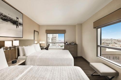 a hotel room with two beds and a window at Hampton Inn San Francisco Downtown/Convention Center in San Francisco