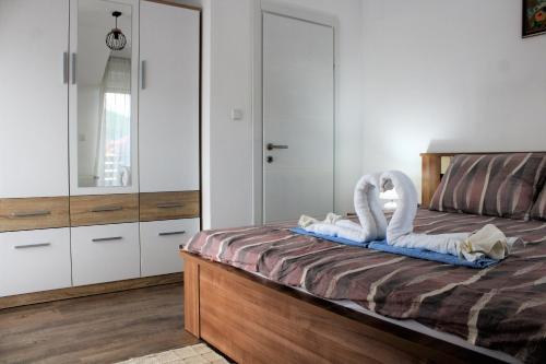 Katil atau katil-katil dalam bilik di Apartman Swans