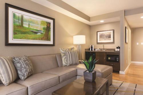 a living room with a couch and a table at Hilton Garden Inn Wallingford/Meriden in Wallingford