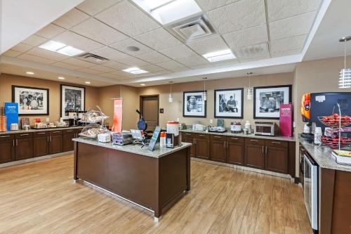 a large room with a lobby with a counter top at Hampton Inn & Suites Claremore in Claremore