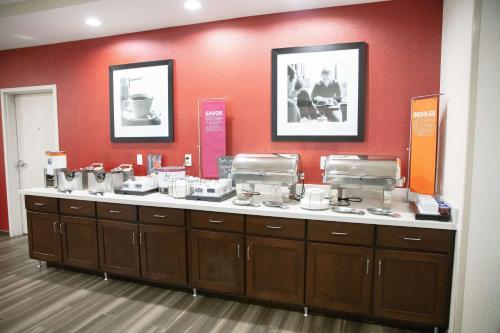 a counter in a store with a bunch of dishes at Hampton Inn & Suites - Toledo/Oregon in Oregon