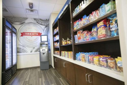 a grocery store aisle with a vending machine in a store at Hampton Inn Toledo Oregon in Oregon