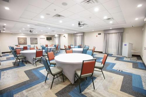 a large room with tables and chairs in it at Hampton Inn Toledo Oregon in Oregon