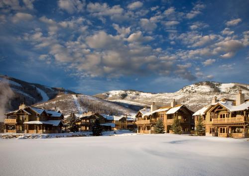 a resort in the snow with snow covered buildings at Hotel Park City, Autograph Collection in Park City