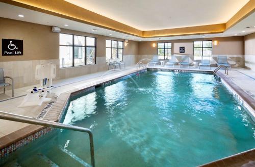 a large swimming pool in a hotel room at Homewood Suites by Hilton Houston/Katy Mills Mall in Katy