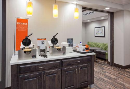 a waiting area in a hospital with a dental office at Hampton Inn & Suites Sioux City South, IA in Sioux City
