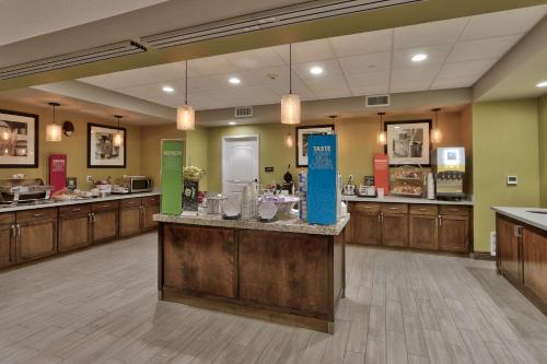 a restaurant with a counter in a large room at Hampton Inn & Suites Las Cruces I-10, Nm in Las Cruces