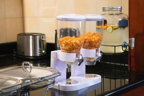 a blender on a counter with some food in it at 96 Hostel Dubai in Dubai