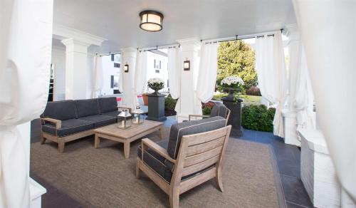 a living room with couches and a table at The Campbell House Lexington, Curio Collection by Hilton in Lexington