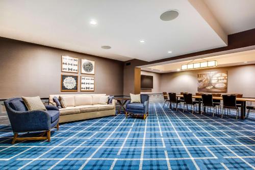 a waiting room with a couch and chairs at The Campbell House Lexington, Curio Collection by Hilton in Lexington