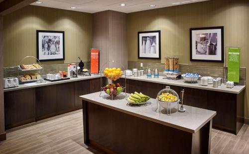 a waiting room with a bunch of fruit on display at Hampton Inn by Hilton Sarnia/Point Edward in Point Edward