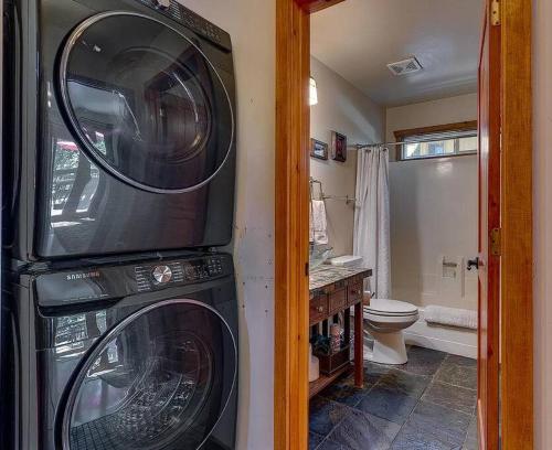 a bathroom with two washer and dryer at Lake Retreat House in Kings Beach