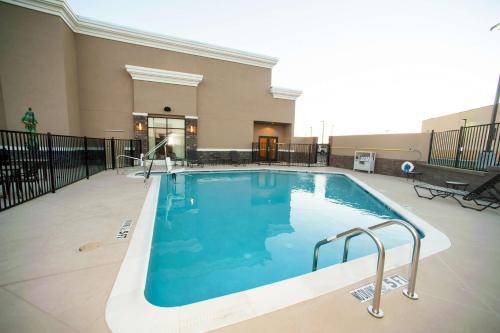 a large swimming pool in a building at Hilton Garden Inn San Antonio-Live Oak Conference Center in San Antonio