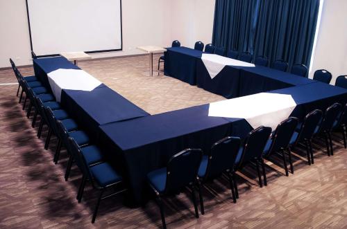 a long blue table and chairs in a room at Hampton Inn by Hilton Durango in Durango