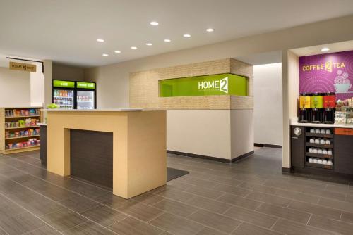 a lobby of a store with a hong pharmacy at Home2 Suites By Hilton Baton Rouge in Baton Rouge