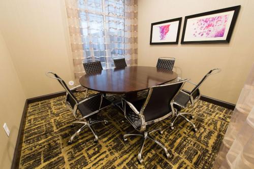a dining room with a table and chairs at Homewood Suites by Hilton Concord in Concord