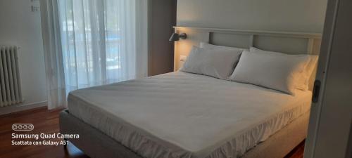 En eller flere senge i et værelse på Appartamento San Francesco 15