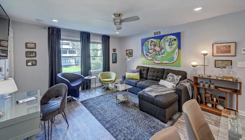 a living room with a couch and a table at The Home Collection CLT: 510 Queens in Charlotte