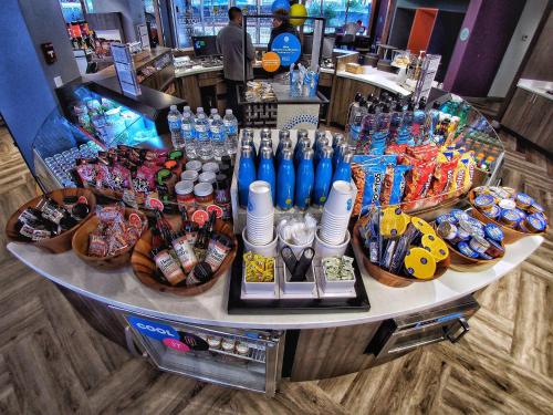 a store counter with a large assortment of food and drinks at Tru By Hilton Oklahoma City Airport, Ok in Oklahoma City