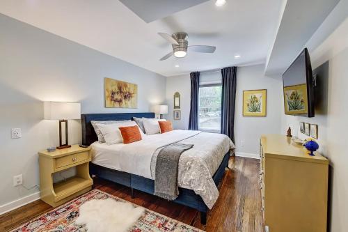 a bedroom with a large bed and a window at The Home Collection CLT: 510 Queens in Charlotte