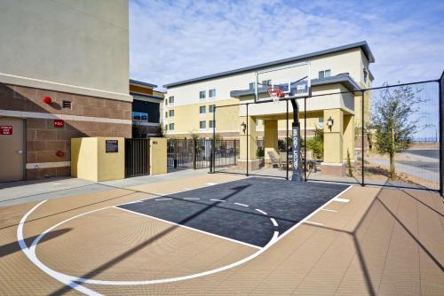 a basketball court with a hoop in front of a building at Homewood Suites By Hilton Phoenix Tempe Asu Area in Tempe