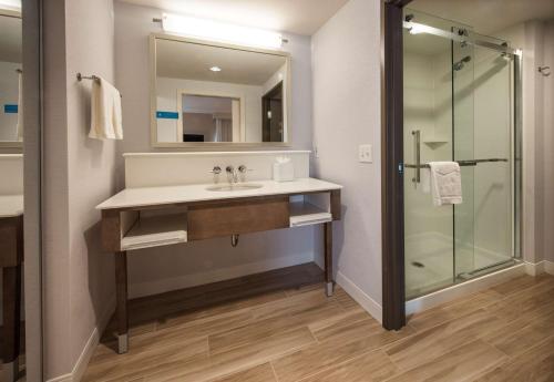 a bathroom with a sink and a shower at Hampton Inn & Suites Seattle/Redmond Wa in Redmond