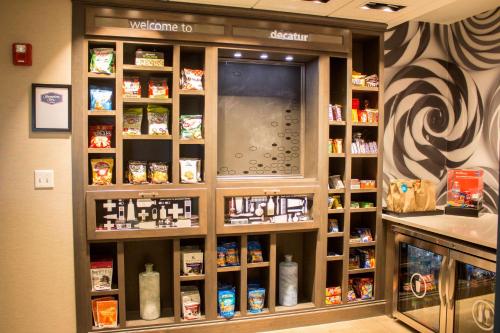 a store with a display of products on a shelf at Hampton Inn Decatur, Mt. Zion, IL in Decatur