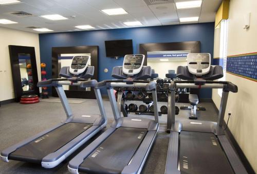 a gym with three tread machines in a room at Hampton Inn Decatur, Mt. Zion, IL in Decatur