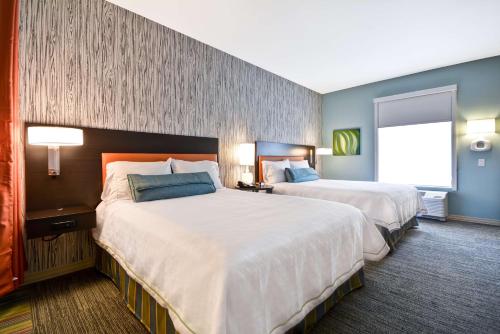 Ένα ή περισσότερα κρεβάτια σε δωμάτιο στο Home2 Suites By Hilton Evansville