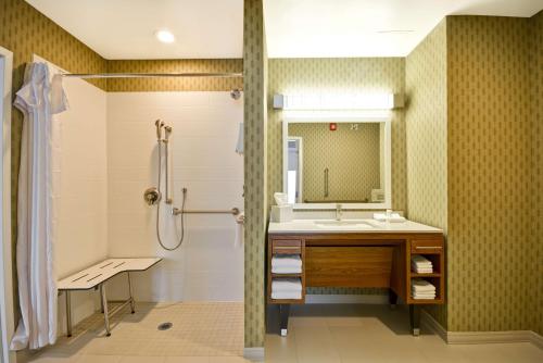 a bathroom with a sink and a shower at Home2 Suites By Hilton Evansville in Evansville