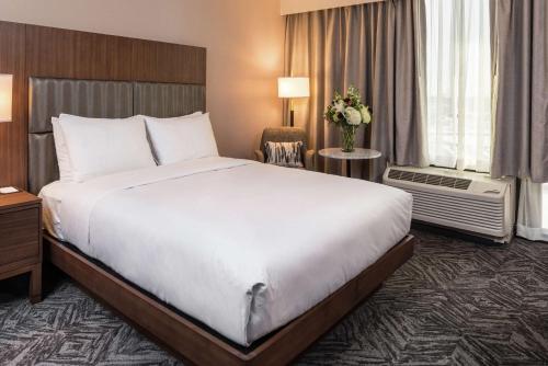 a large white bed in a hotel room at Doubletree By Hilton Lafayette East in Lafayette
