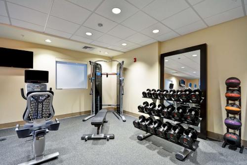 a gym with cardio equipment and a mirror at Home2 Suites By Hilton Livermore in Livermore