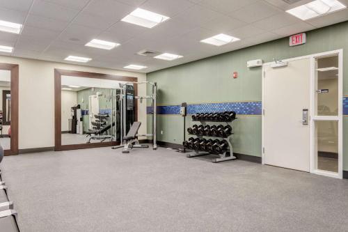 a gym with treadmills and weights in a building at Hampton Inn-St. Louis Wentzville, MO in Wentzville