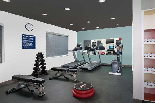 a gym with cardio equipment in a room at Tru By Hilton McDonough in McDonough