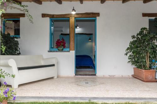 a living room with a couch and a window at hotel Piccolo Ranch in Pula