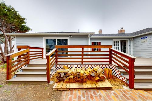 a house with a porch with a wooden fence at Saddle Point Estate in Elk