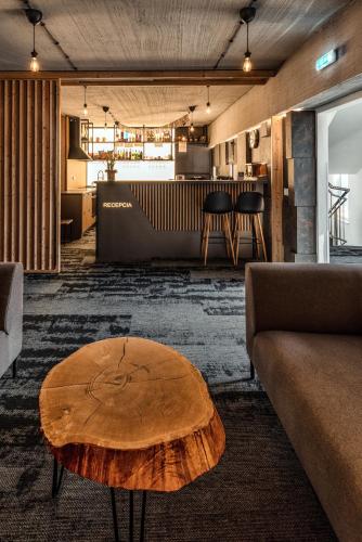 a living room with a wooden coffee table at Apartmány Tri sestry Jasná in Demanovska Dolina