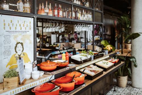 a store with a buffet of food on display at Emma by Schulz Hotel Berlin Friedrichshain in Berlin