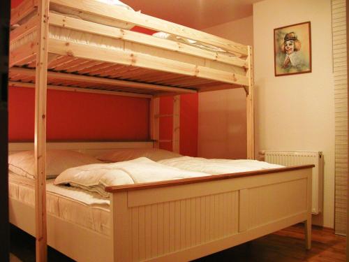 a bedroom with a bunk bed with a ladder at Ferienwohnung Usedomresidenz in Ostseebad Karlshagen